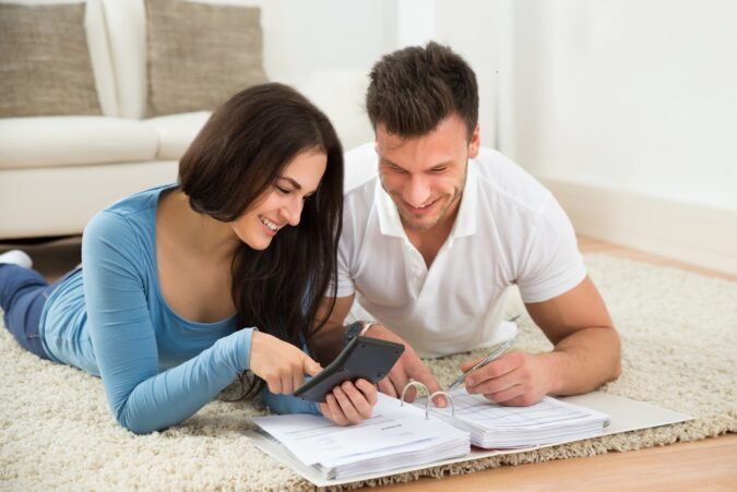 Financial Goals Happy Young Couple discussing financial goals