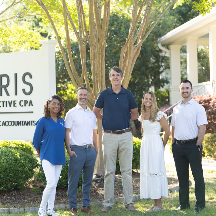 Veris CPA - Summerville location -partners group photo near the office sign